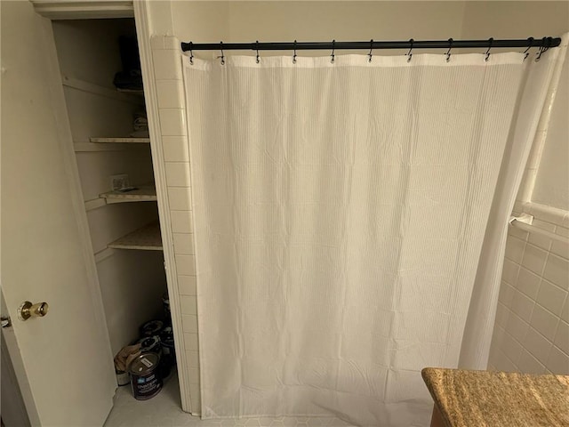 bathroom featuring curtained shower