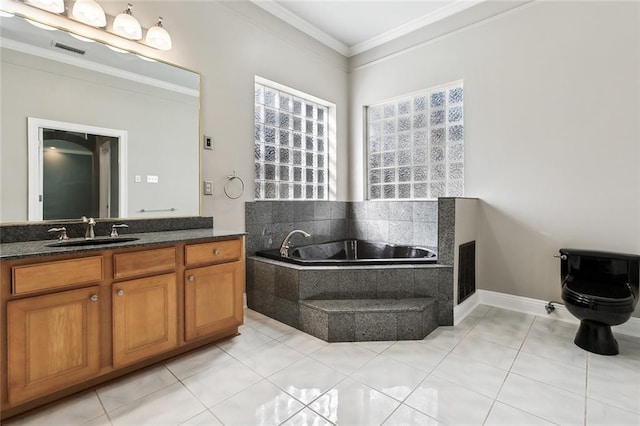 bathroom featuring a garden tub, visible vents, ornamental molding, vanity, and tile patterned floors