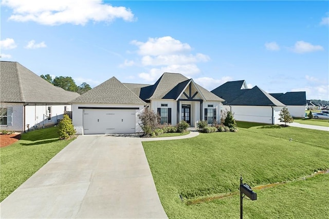 view of front of house featuring a garage, a front yard, concrete driveway, and a shingled roof