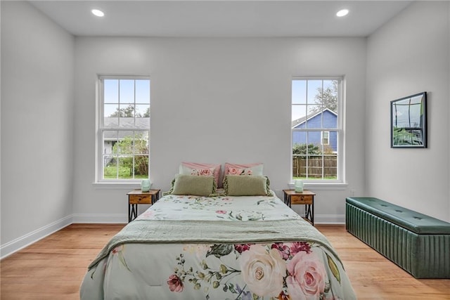 bedroom featuring light wood-style floors, baseboards, and recessed lighting