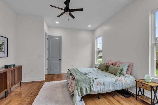 bedroom featuring recessed lighting, ceiling fan, baseboards, and wood finished floors