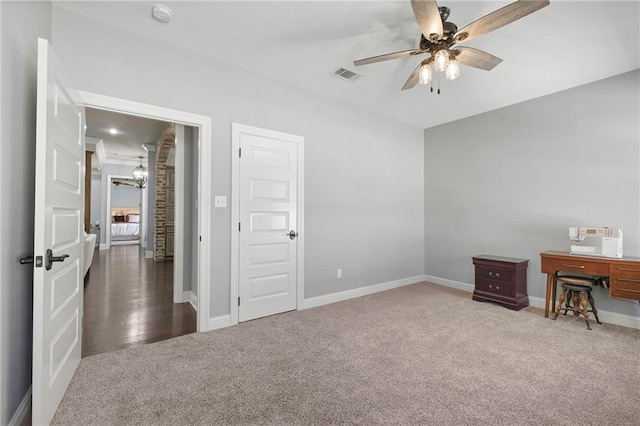 home office with baseboards, ceiling fan, visible vents, and carpet flooring