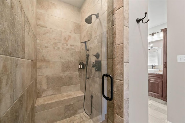 bathroom featuring a shower stall and vanity