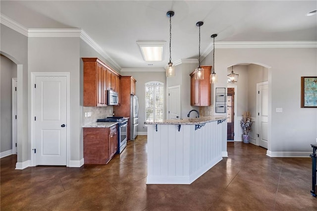 kitchen with tasteful backsplash, concrete floors, appliances with stainless steel finishes, and arched walkways