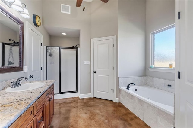 bathroom with a stall shower, visible vents, a ceiling fan, vanity, and a bath