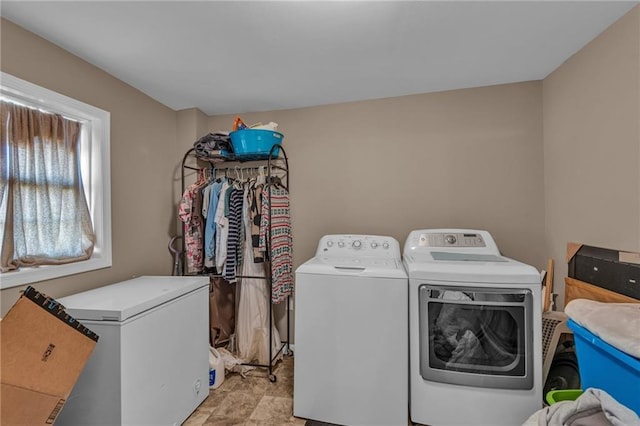 washroom featuring laundry area and washing machine and clothes dryer