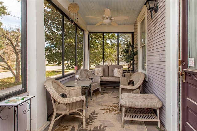 sunroom / solarium with plenty of natural light and a ceiling fan