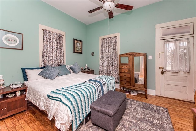 bedroom featuring wood finished floors and a ceiling fan