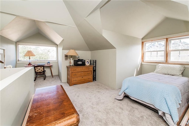 bedroom with light carpet and vaulted ceiling