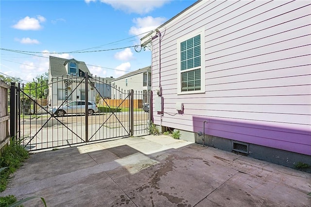 view of gate with fence