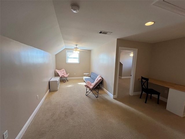 unfurnished room with carpet floors, baseboards, visible vents, and lofted ceiling