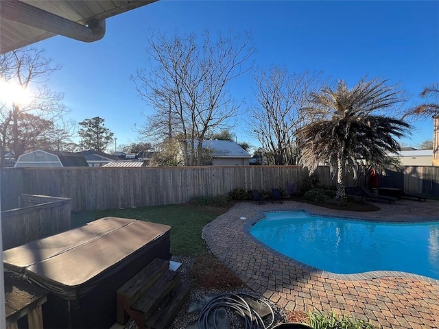 view of pool featuring a patio area, a fenced backyard, and a fenced in pool