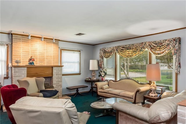 carpeted living area with visible vents, a fireplace, and crown molding