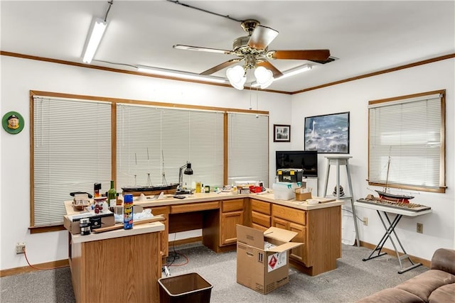 home office with baseboards, light colored carpet, ceiling fan, and crown molding