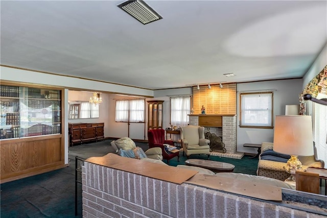 carpeted living room featuring visible vents and a brick fireplace