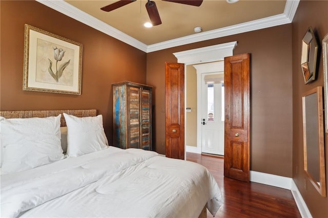 bedroom with ornamental molding, ceiling fan, baseboards, and wood finished floors