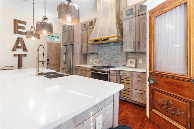1244 Annunciation St, New Orleans, LA 70130 - kitchen with appliances with stainless steel finishes, premium range hood, crown molding, and tasteful backsplash