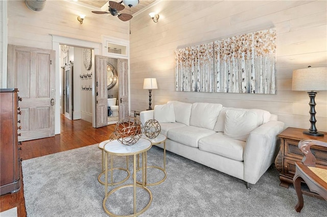 1244 Annunciation St, New Orleans, LA 70130 - living room with a ceiling fan, wooden walls, and wood finished floors