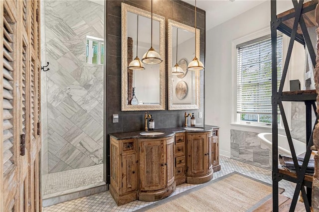1244 Annunciation St, New Orleans, LA 70130 - full bathroom with double vanity, a stall shower, tile patterned floors, a sink, and tile walls