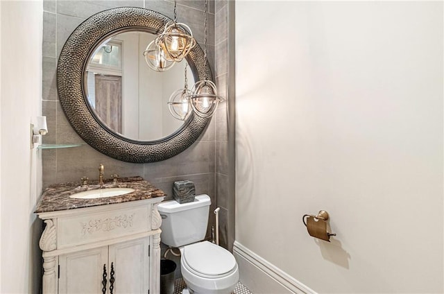 1244 Annunciation St, New Orleans, LA 70130 - bathroom featuring tile walls, toilet, and vanity