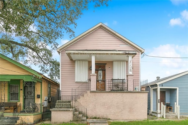 3424 Toledano St, New Orleans, LA 70125 - shotgun-style home with a porch