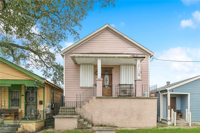 shotgun-style home with a porch