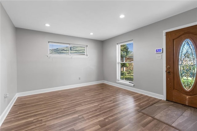 foyer entrance with recessed lighting, wood finished floors, and baseboards