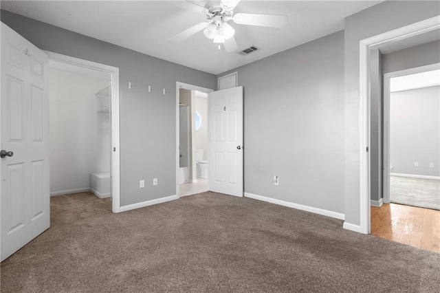 unfurnished bedroom featuring baseboards, visible vents, and carpet flooring