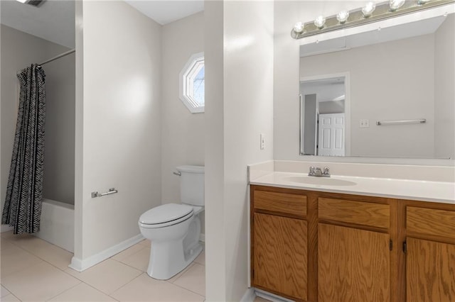 full bathroom with shower / bath combination with curtain, toilet, vanity, baseboards, and tile patterned floors