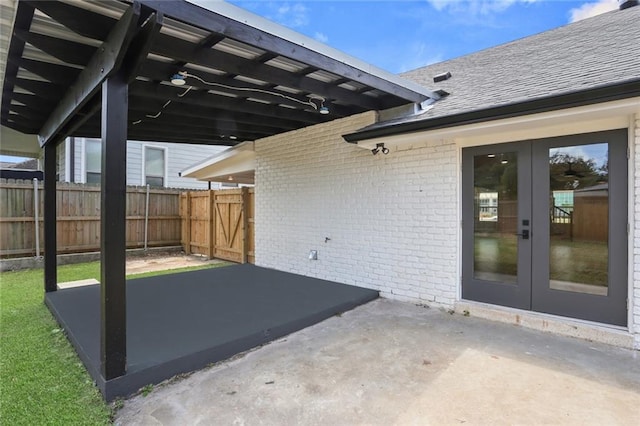 6043 Paris Ave, New Orleans, LA 70122 - view of patio featuring french doors