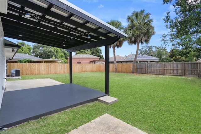 6043 Paris Ave, New Orleans, LA 70122 - view of yard featuring a patio area and central AC