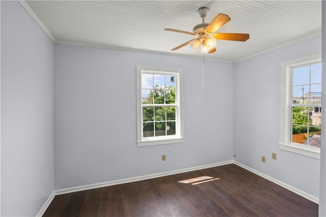 unfurnished room featuring a wealth of natural light, baseboards, and wood finished floors