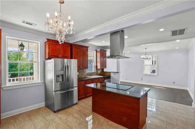 kitchen featuring visible vents, island exhaust hood, appliances with stainless steel finishes, and a chandelier