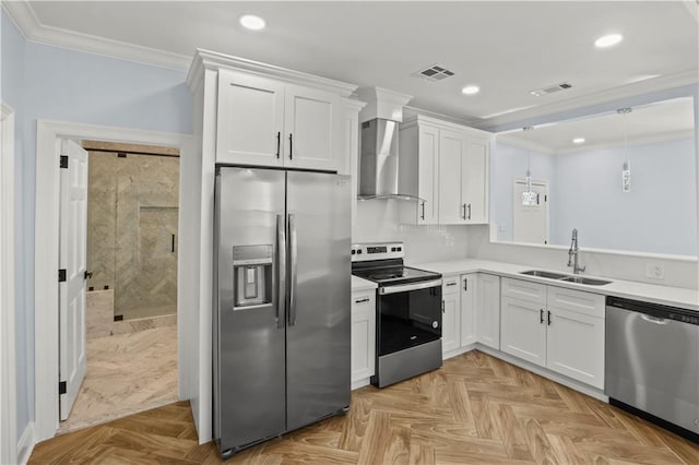 kitchen with wall chimney exhaust hood, ornamental molding, stainless steel appliances, white cabinetry, and a sink