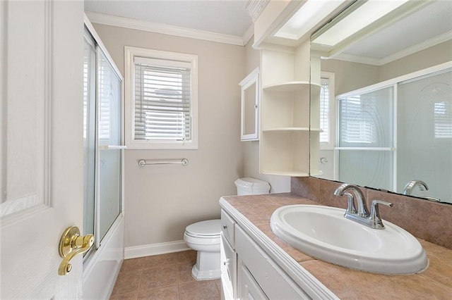 bathroom featuring baseboards, toilet, tile patterned flooring, crown molding, and vanity