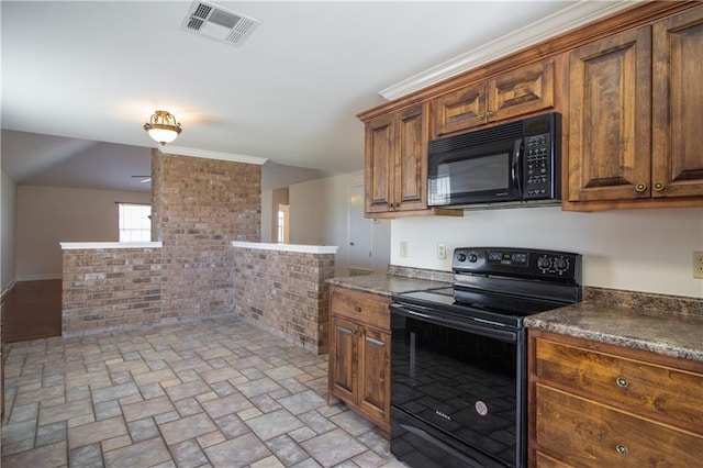 kitchen featuring brown cabinets, dark countertops, visible vents, and black appliances