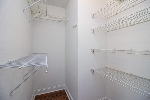 spacious closet with wood finished floors