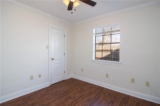 empty room featuring crown molding, dark wood finished floors, baseboards, and a ceiling fan