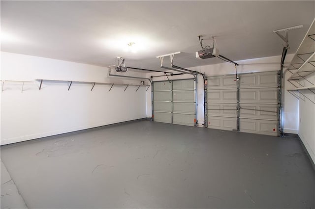 garage featuring baseboards and a garage door opener