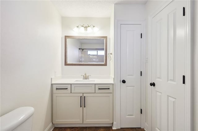 38 Moss Dr, La Place, LA 70068 - full bathroom with baseboards, a shower, toilet, a textured ceiling, and vanity