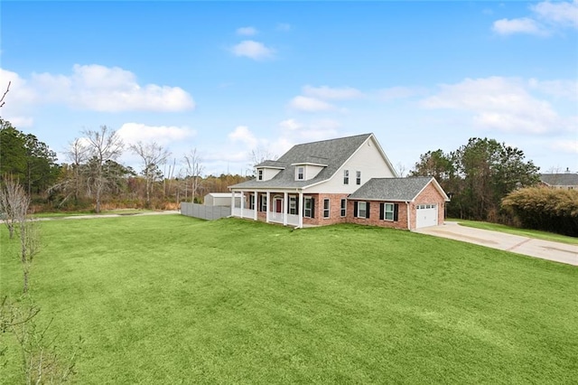 view of front of property featuring a front lawn, brick siding, driveway, and an attached garage