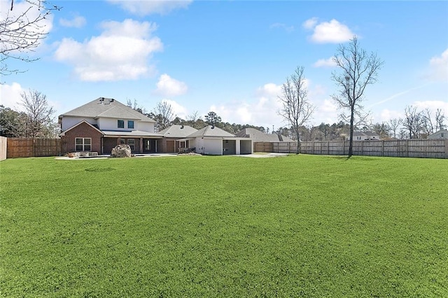 view of yard featuring a patio and a fenced backyard