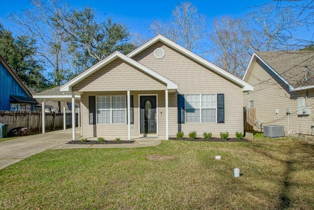 view of front facade featuring driveway, fence, a front lawn, and central AC unit