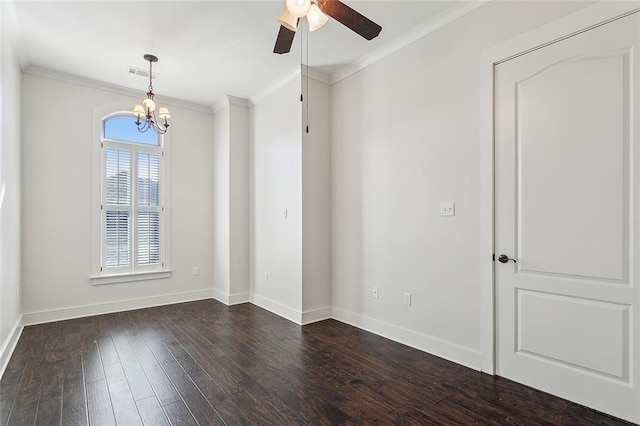 spare room featuring dark wood-style floors, baseboards, visible vents, and crown molding