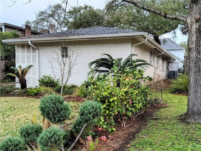 view of property exterior with brick siding