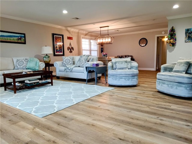 living area with recessed lighting, visible vents, ornamental molding, wood finished floors, and a chandelier