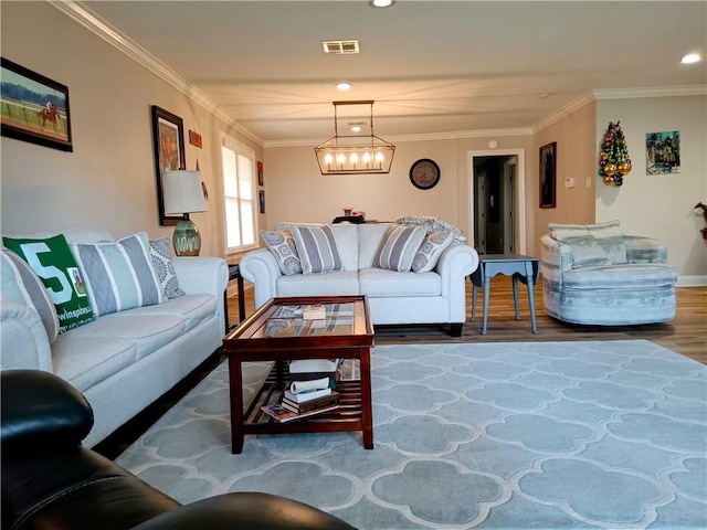 living area featuring a chandelier, recessed lighting, wood finished floors, visible vents, and crown molding