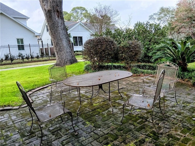 view of patio featuring fence