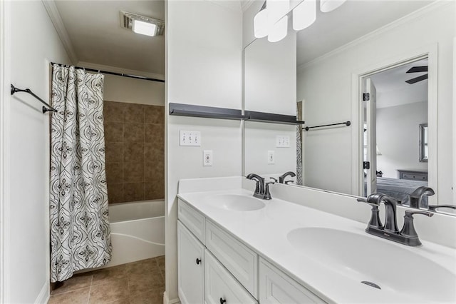 ensuite bathroom with visible vents, ornamental molding, a sink, and tile patterned floors