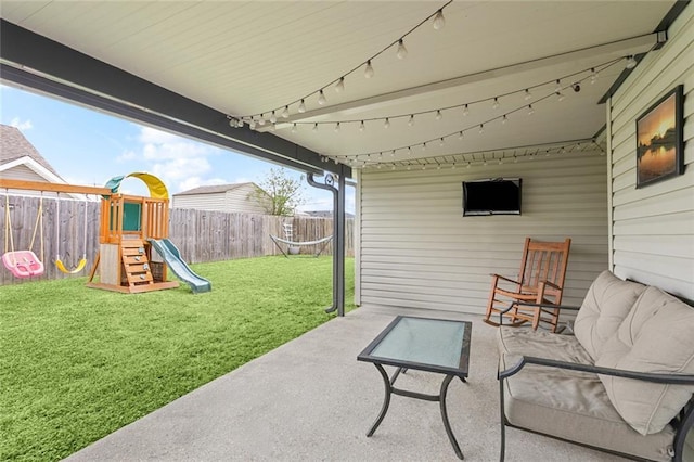 view of patio with a fenced backyard and a playground